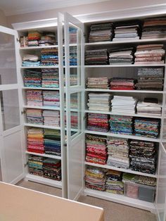 the closet is filled with many different types of fabrics