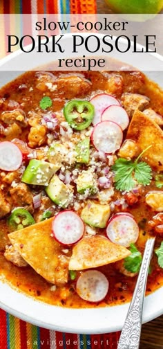 slow cooker pork posole recipe in a white bowl on a colorful table cloth