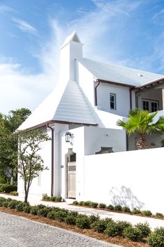 a white building with a clock on it's side