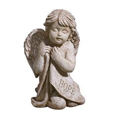 an angel statue with the word hope on it