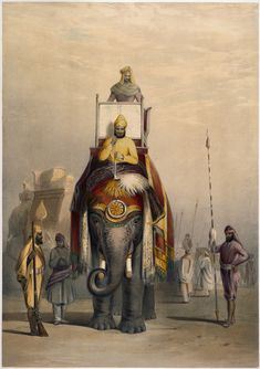 an elephant with a man sitting on it's back in front of other people