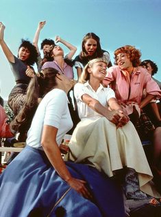 a group of women sitting next to each other