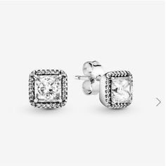 Add Just The Right Amount Of Sparkle To Your Ears With This Timeless And Elegant Pair Of Square Ear Studs. Stunning Danube-Cut Cubic Zirconia Are Framed With A Halo Of Smaller Stones To Recreate The Feel Of Heirloom Jewelry, Proving That Bygone Glamour Is As Relevant Today As Ever. Made From Sterling Silver, They're A Solid Accessorizing Choice: Make Them Your Everyday Signature Or Wear Them For Special Occasions. Stone Cubic Zirconia Colour Clear Product Type Earrings Item 290591cz Metal Sterli Pandora Earrings Studs, Charms Disney, Pandora Essence, Pandora Earrings, Halo Stud Earrings, Halo Necklace, Heirlooms Jewelry, Halo Earrings Studs, Pandora Silver