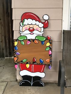 a santa clause sign on the side of a house