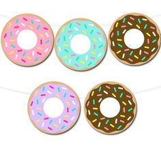 four donuts with sprinkles are hanging on a string and one has been cut out