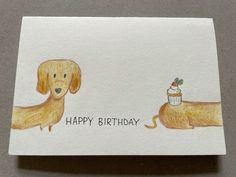 a card with a drawing of a dog and a cupcake on it that says happy birthday