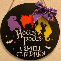 a sign that says hoccus pocus i smell children