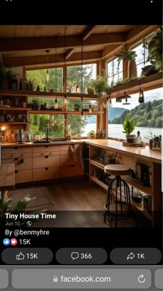 a kitchen filled with lots of wooden furniture next to a window covered in potted plants