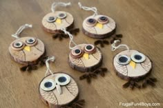 wooden ornaments with eyes and leaves on them