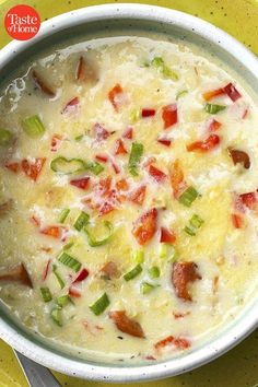 a bowl filled with soup on top of a yellow plate