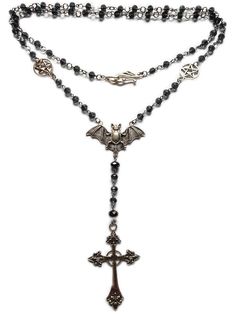 With a full length of approx 90cm this item can be worn as a long single strand or doubled up for a choker effect.  The ornate clasp sits in front when doubled up adding to the beauty and versatility of this piece.  Each faceted glass bead is linked on stainless steel that will not rust or tarnish with wear. the gothic cross pendant is approx 7 cm in length and is made of  silver toned alloy, as is the bat and pentacles.  Lovingly handcrafted , this necklace is sure to please! Gothic Beaded Cross Jewelry, Elegant Single Strand Jewelry For Festival, Gothic Necklaces With Beaded Metal Chain, Gothic Metal Necklace With Beaded Chain, Adjustable Cross Necklace With 108 Beads, Adjustable Victorian Metal Necklace, Beaded Metal Lariat Necklace, Adjustable Gothic Jewelry With Round Beads, Gothic Rosary