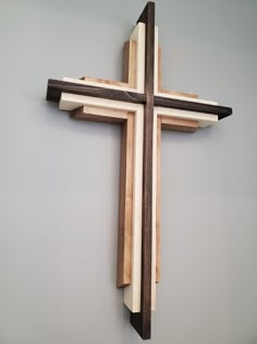 a wooden cross hanging on the wall