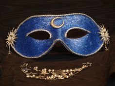 a blue masquerade with stars and moon decorations