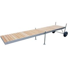 a long wooden bench with wheels attached to it