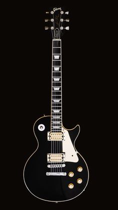 an electric guitar is shown against a black background