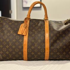 Authentic Like New Louis Vuitton Monogram Keepall 55 Duffle Bag. Date Code Sd0015 France 01/2005. Lv Lock Included But No Keys. This Model Does Not Have A Shoulder Strap. Minimal Blemishes See Photos. Original List Price $2210 Travel Bags, Louis Vuitton Monogram, Louis Vuitton Bag, Duffle Bag, Shoulder Strap, Bag Lady, Like New, Louis Vuitton, Monogram