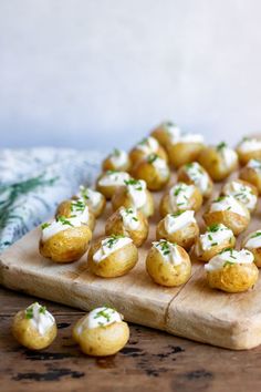 small appetizers are arranged on a cutting board