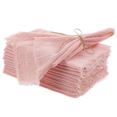 a stack of pink towels folded on top of each other