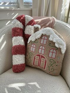 a pillow with a gingerbread house on it