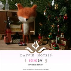 an advertisement for the dawlk hotels boxing day with a stuffed fox in front of a christmas tree