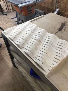 a workbench is being worked on in a wood shop