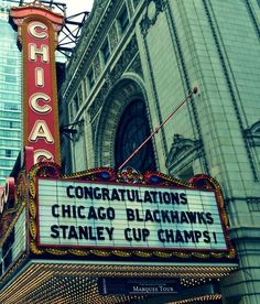 an old theater sign with the words chicago written on it's marquee