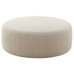 a white round ottoman sitting on top of a floor