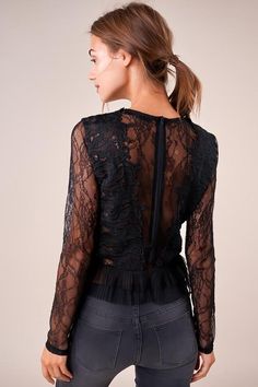 The Temptress is a sheer lace top covered in a floral design. The top features a high neckline, long fitted sleeves, and a darted bodice with a cropped, pleated hem. This ultra-sultry number is perfect for showing off your midriff in jeans and heels. Model is 5'9" and wearing size small. Pre-Order Now! Estimated Shipping Date October 25, 2019. Available in black. 100% polyester. Imported. Chic Fitted Long Sleeve Mesh Top, Fitted Long Sleeve Chic Mesh Top, Chic Fitted Long-sleeve Mesh Top, Fitted Lace Mesh Top With Lace Trim, Fitted Elegant Mesh Top With Sheer Bodice, Elegant Fitted Mesh Top With Sheer Bodice, Feminine Fitted Mesh Top For Night Out, Fitted Black Mesh Top With Lace Trim, Elegant Fitted Long Sleeve Mesh Top