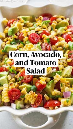 corn, avocado, and tomato salad in a white dish with the title overlay