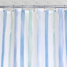 a shower curtain with blue and green stripes