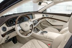 the interior of a mercedes s - class sedan, with its dashboard and steering wheel