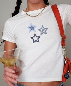 Embrace the nostalgia of the Y2K era with our Blue Denim Star Baby Tee. This Downtown Girl Aesthetic top exudes 90s vibes and captures the essence of a Vanilla Girl's wardrobe. Perfect for the Gen Z crowd looking for Preppy Stuff with a touch of cute Teenage Girl charm. Ideal as a stylish and unique gift for the fashion-forward individual. 🖤 100% USA cotton (Note: Sports Gray color variation features 90% Cotton & 10% Polyester) 🖤 Ribbed knit, crew neckline, and tear away label 🖤 90s style bab Trendy Blue Star Print Top, Trendy Blue Top With Star Print, Fitted Blue Top With Star Print, Blue Star Print Top With Relaxed Fit, Vanilla Girl Clothes, Downtown Girl Aesthetic, Preppy Stuff, Y2k Era, Y2k Baby Tee