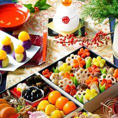 two trays filled with different types of candy and candies on top of a table