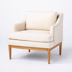 a white chair sitting on top of a wooden frame