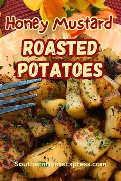 roasted potatoes on a plate with a fork and flowers in the background text reads honey mustard roasted potatoes