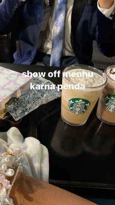 two cups of coffee sitting on top of a table next to each other with the words show off menu karna penda