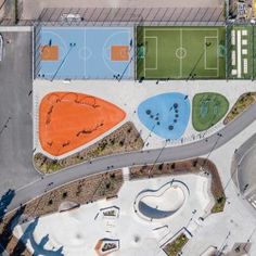 an aerial view of a basketball court and sports field in the middle of a parking lot