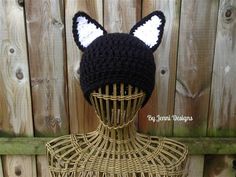 a knitted hat with ears on top of a mannequin head