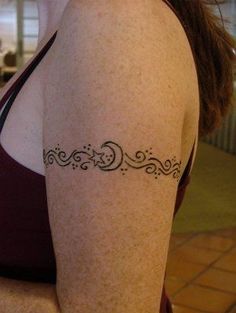 a woman with a tattoo on her arm