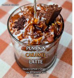 pumpkin caramel latte in a glass with whipped cream and chocolate toppings on top