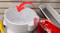 a white colander sitting on top of a counter