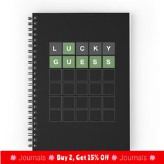 a black spiral notebook with the words lucky guess written in green and white on it