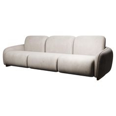 a white couch sitting on top of a wooden floor