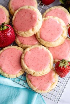 strawberry shortbread cookies on a cooling rack with fresh strawberries