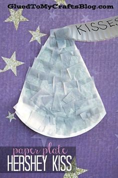 the paper plate hershey kiss craft is made with white and purple stars on a purple background