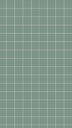 a green tiled wall with small squares on it