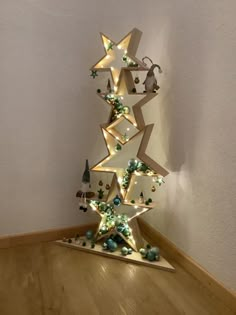 a christmas tree made out of cardboard with lights