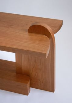 a wooden bench with one section cut out and the other half closed to show it's interior