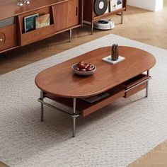 a living room scene with focus on the coffee table and entertainment center in the background