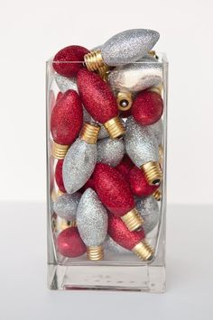 red and silver ornaments in a clear vase